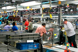 In this Thursday, Jan. 9, 2014, file photo, workers assemble ovens at the new Electrolux home cooking appliance factory in Memphis, Tenn. Electrolux says it is stopping production at its Memphis, Tennessee, factory while investing $250 million in a separate facility in the state. The Stockholm-based maker of Frigidaire products said Thursday that it is consolidating all U.S. cooking manufacturing into its facility in Springfield.
