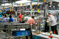 In this Thursday, Jan. 9, 2014, file photo, workers assemble ovens at the new Electrolux home cooking appliance factory in Memphis, Tenn. Electrolux says it is stopping production at its Memphis, Tennessee, factory while investing $250 million in a separate facility in the state. The Stockholm-based maker of Frigidaire products said Thursday that it is consolidating all U.S. cooking manufacturing into its facility in Springfield.