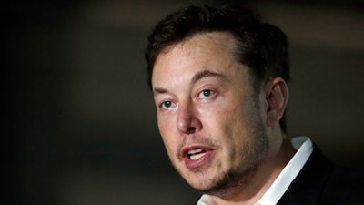 In this June 14, 2018, file photo, Tesla CEO Elon Musk speaks at a news conference in Chicago. Stock market regulators are asking a federal court to hold Musk in contempt for violating an agreement requiring him to have his tweets about key company information reviewed for potentially misleading claims. The request made Monday, Feb. 25, 2019 in New York resurrects a dispute between the Securities and Exchange Commission and Musk that was supposed to have been resolved with a settlement reached five months ago.