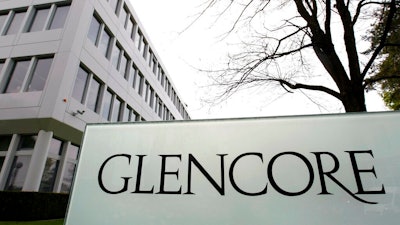 This April 14, 2011 file picture shows the Glencore headquarters in Baar, Switzerland. Commodities giant Glencore says it will cap how much coal it mines amid shareholder pressure to reduce emissions of greenhouse gases.