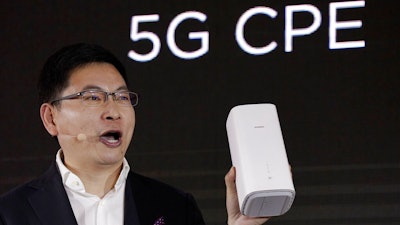 In this Jan. 24, 2019, file photo Richard Yu, CEO of the Huawei consumer business group speaks as he unveils the wireless router running with 5G modem Balong 5000 chipset in Beijing. Security experts say the U.S. government is likely exaggerating the threat it says the Chinese telecommunications giant Huawei poses to the world’s next-generation wireless networks. Critics say the U.S. case is short on specifics and glosses over the fact that China doesn’t need secret access to Huawei routers to infiltrate global networks.