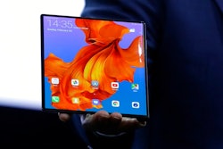 Huawei CEO Richard Yu displays the new Huawei Mate X foldable 5G smartphone at the Mobile World Congress, in Barcelona, Spain, Sunday, Feb. 24, 2019. The fair started with press conferences on Sunday, before the doors open on Monday, Feb. 25, and runs until Feb. 28.