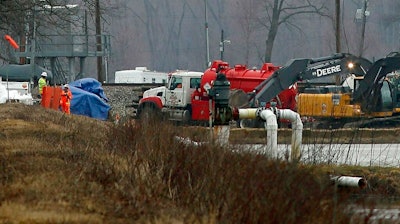 Excavation equipment is used to search for an oil leak close to where the TransCanada Corp's Keystone oil pipeline runs through northern St. Charles County off of Highway C, Thursday, Feb. 7, 2019, near St. Charles, Mo. The source of the oil leak has not yet been identified but the Keystone oil pipeline has been shut and the Missouri Department of Natural Resources official said the the release is stopped.