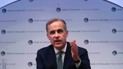 The Governor of the Bank of England, Mark Carney speaks during a news conference to confirm the main interest rate will remain at 0.75 percent, at the Bank of England in London, Thursday Feb. 7, 2019. The Bank of England said that Brexit uncertainties and a weaker global economy overall, mean that British growth in 2019 is likely to be 1.2 percent.