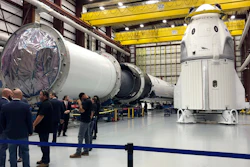 In this file photo, SpaceX's Dragon capsule, right, sits in a SpaceX hangar in Cape Canaveral, Florida.