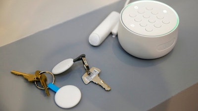 In this Sept. 20, 2017, file photo the Nest Secure alarm system is seen on display during an event in San Francisco. Google says it forgot to mention that it included a microphone in the security product it began selling in 2017, but blames the omission on an error. When the company’s Nest Secure home alarm system hit the market, its product information didn’t mention a microphone. Google said in a statement that the microphone wasn’t intended to be a secret and should have been disclosed.
