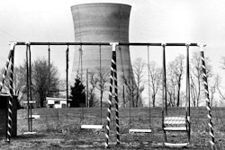 This March 30, 1979, file photo shows a cooling tower of the Three Mile Island nuclear power plant near Harrisburg, Pa., as it looms behind an abandoned playground. Forty years after Three Mile Island became synonymous with America's worst commercial nuclear power accident, the prospect of bailing out nuclear power plants is stirring debate at the highest levels of Pennsylvania and the federal government.