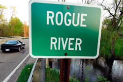 In this May 16, 2018 file photo the Rogue River flows underneath Algoma Ave. NE in Algoma Township, Mich. The Michigan DEQ is asking Wolverine World Wide to expand perfluoroalkyl and polyfluoroalkyl compounds, or PFAS, testing in the area. There’s growing evidence that long-term exposure to the perfluoroalkyl and polyfluoroalkyl compounds, or PFAS, can be dangerous, even in tiny amounts. The Environmental Protection Agency is looking at how to respond to a public push for stricter regulation of the chemicals, in production since the 1940s. A decision is expected soon.