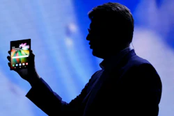 In this Nov. 7, 2018 file photo,, Justin Denison, SVP of Mobile Product Development, shows off the Infinity Flex Display of a folding smartphone during the keynote address of the Samsung Developer Conference, in San Francisco. Samsung is expected to show off its latest smartphones Wednesday, Feb. 20, 2019, the latest effort by a phone maker to come up with new features compelling enough to end a sales slump.