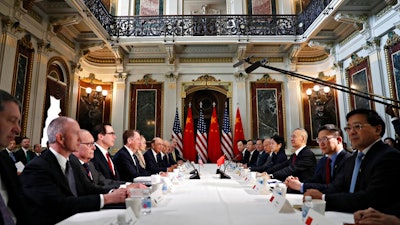 In this Thursday, Feb. 21, 2019, file photo, U.S. and Chinese delegations meet in the Indian Treaty Room in the Eisenhower Executive Office Building on the White House complex during continuing meetings on the U.S.-China bilateral trade relationship in Washington. Relief swept across world financial markets Monday after President Donald Trump pushed back a March 2 deadline in a trade dispute with China. But the respite might not last.