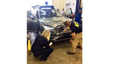 An autonomous Volvo is examined after the crash that killed pedestrian Elaine Herzberg.