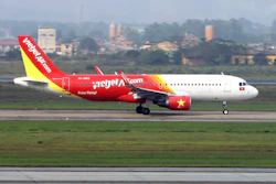 In this Feb. 19, 2019, photo, a Vietjet airplane taxis on the runway in Noi Bai airport, Hanoi, Vietnam. U.S. President Donald Trump and Vietnamese President Nguyen Phu Trong have presided over a signing ceremony for several commercial trade deals in Hanoi, including agreements to sell 110 Boeing aircraft worth billions of dollars to the booming Southeast Asian country.