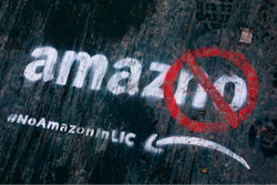 In this Nov. 16, 2018, file photo graffiti has been painted on a sidewalk by someone opposed to the location of an Amazon headquarters in the Long Island City neighborhood in the Queens borough of New York. Amazon said Thursday, Feb. 14, 2019, that it is dropping New York City as one of its new headquarter locations.