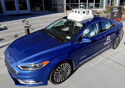 In this Dec. 18, 2018, photo a sensor and camera array on top of one of the test vehicles from Argo AI, Ford's autonomous vehicle unit, is parked at the company offices in Pittsburgh. Even the most optimistic experts say it will be 10 years before self-driving vehicles are everywhere, but others believe it will take decades. The biggest reasons are camera and laser sensors that can’t see through heavy snow or figure out where to go if lane lines are covered.