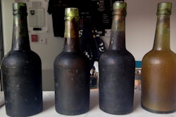 In this July 17, 2017 photo provided by Jamie Adams, four bottles recovered from the SS Oregon, a 133-year-old shipwreck, are shown at the Saint James Brewery in Holbrook, N.Y.