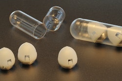 This undated photo provided by researchers in February 2019 shows the components of swallowable self-righting device which can inject drugs from inside the stomach. The new invention, reported Thursday, Feb. 7, 2019, by an MIT-led research team, has been tested only in animals so far. But if it pans out, it might offer a work-around to make not just insulin but a variety of usually injected medicines a little easier to take.