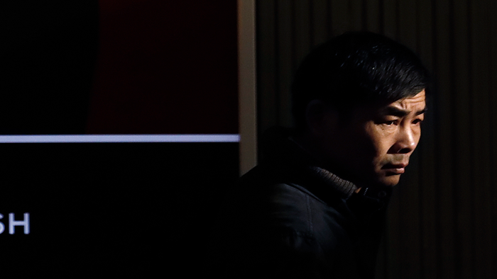 A man passes by a Chanel Fine jewelry retail outlet at the Central Business District in Beijing, Wednesday, March 6, 2019. China will bar government authorities from demanding overseas companies hand over technology secrets in exchange for market share, a top economic official said Wednesday, addressing a key complaint at the heart of the current China-U.S. trade dispute.