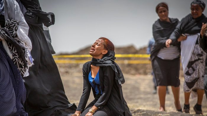 Ethiopian relatives of crash victims mourn and grieve at the scene where the Ethiopian Airlines Boeing 737 Max 8 crashed shortly after takeoff on Sunday killing all 157 on board, near Bishoftu, south-east of Addis Ababa, in Ethiopia Thursday, March 14, 2019. The French air accident investigation authority said Thursday that it will handle the analysis of the black boxes retrieved from the crash site and they have already arrived in France but gave no time frame on how long the analysis could take.