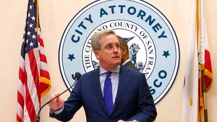 San Francisco City Attorney Dennis Herrera announces that he's cracking down on the sale of e-cigarettes that he says aggressively target youth, at a City Hall news conference Tuesday, March 19, 2019. Legislation to be introduced would ban the sale of e-cigarettes anywhere in the city and county of San Francisco until the FDA has reviewed the product for sale.