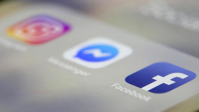 Facebook, Messenger and Instagram apps are are displayed on an iPhone on Wednesday, March 13, 2019, in New York. Facebook says it is aware of outages on its platforms including Facebook, Messenger and Instagram and is working to resolve the issue.