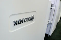 This Tuesday, May 24, 2016 file photo shows Xerox copiers at a store, in North Andover, Mass. Xerox is reorganizing under a new holding company, saying that it will have more strategic, operational and financial flexibility. Xerox Corp. said in a regulatory filing Thursday, March 7, 2019 that the reorganization won’t change its business operations, directors or executive officers.