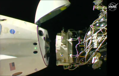 In this image taken from NASA Television, SpaceX's swanky new crew capsule undocks from the International Space Station Friday, March 8, 2019. The capsule undocked and is headed toward an old-fashioned splashdown. The Dragon capsule pulled away from the orbiting lab early Friday, a test dummy named Ripley its lone occupant.