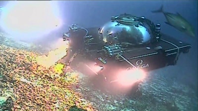 An image taken from video issued by Nekton shows a submersible from the vessel the Ocean Zephyr during a descent into the Indian Ocean off Alphonse Atoll near the Seychelles, Tuesday March 12, 2019. Members of the British-led Nekton research team boarded two submersible vessels and descended into the waters off the Seychelles.