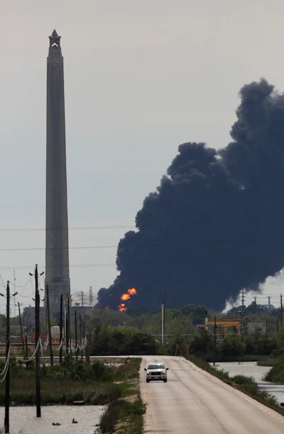 A view of the petrochemical fire at the Intercontinental Terminals Company, which is less than two miles southwest of the San Jacinto Memorial Monday, March 18, 2019, in Baytown, Texas. The large fire at a Houston-area petrochemicals terminal will likely burn for another two days, authorities said Monday, noting that air quality around the facility was testing within normal guidelines.