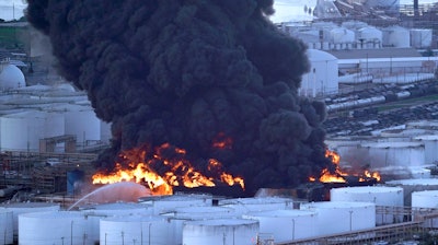 Firefighters battle a petrochemical fire at the Intercontinental Terminals Company Monday, March 18, 2019, in Deer Park, Texas. The large fire at a Houston-area petrochemicals terminal will likely burn for another two days, authorities said Monday, noting that air quality around the facility was testing within normal guidelines.