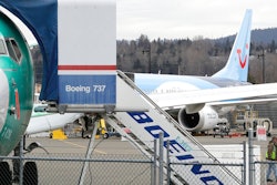 In this photo taken Monday, March 11, 2019, a Boeing 737 MAX 8 airplane being built for TUI Group sits parked in the background at right at Boeing Co.'s Renton Assembly Plant in Renton, Wash. Britain, France and Germany on Tuesday joined a rapidly growing number of countries grounding the new Boeing plane involved in the Ethiopian Airlines disaster or turning it back from their airspace, while investigators in Ethiopia looked for parallels with a similar crash just five months ago.