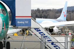 In this Monday, March 11, 2019 file photo, a Boeing 737 MAX 8 airplane being built for TUI Group sits parked in the background at right at Boeing Co.'s Renton Assembly Plant in Renton, Wash. The Transportation Department confirmed that its watchdog agency will examine how the FAA certified the Boeing 737 Max 8 aircraft, the now-grounded plane involved in two fatal accidents within five months. The FAA had stood by the safety of the plane up until last Wednesday, March 13, 2019 despite other countries grounding it.