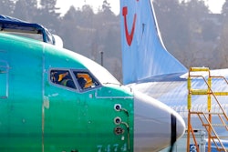 In this March 13, 2019, file photo a worker walks past an engine on a Boeing 737 MAX 8 airplane being built for American Airlines at Boeing Co.'s Renton assembly plant in Renton, Wash. On Wednesday, March 27, the Senate aviation subcommittee will examine how the FAA oversees safety in the commercial aviation industry. Expected to testify is the Transportation Department's inspector general, who is conducting a separate probe of the FAA's decision to approve the Boeing 737 Max aircraft, the type of plane that crashed in October in Indonesia, and this month in Ethiopia.