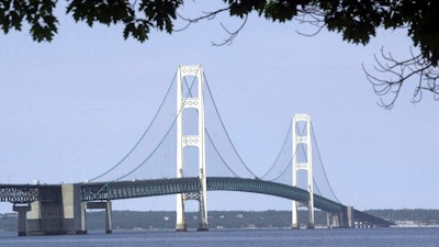 In this July 19, 2002 file photo, the Mackinac Bridge that spans the Straits of Mackinac is shown from Mackinaw City, Mich. Michigan Gov. Gretchen Whitmer has ordered state departments and agencies to take no further action on legislation enacted in late 2018 authorizing construction of an oil pipeline tunnel beneath lakes Huron and Michigan. On Thursday, March 28, 2019, Michigan Attorney General Dana Nessel, deemed unconstitutional a 2018 law that established a panel to oversee construction and operation of an oil pipeline tunnel beneath the channel linking Lakes Huron and Michigan.