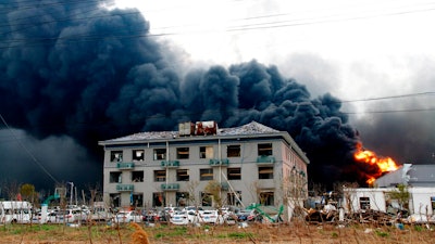 In this Thursday, March 21, 2019, photo, fires burn at the site of a factory explosion in a chemical industrial park in Xiangshui County of Yancheng in eastern China's Jiangsu province. The local government reports the death toll in an explosion at a chemical plant in eastern China has risen with dozens killed and more seriously injured.