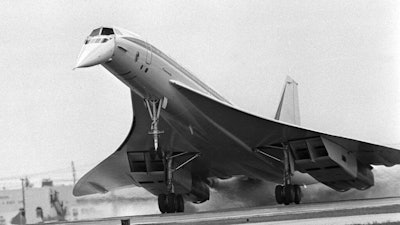 In this June 14, 1974 file photo, the Air France Concorde supersonic airliner touches down at Miami International Airport in Miami, Fla. The flight from Boston's Logan Airport took about 80 minutes. The Concorde's maiden flight was 50 years ago on March 2, 1969. Although the plane went out of service in 2003, its delta-wing design and drooping nose still make it instantly recognizable even to people who have never seen one in person.