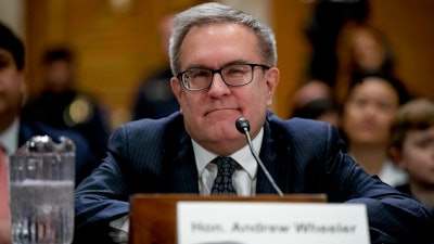 In this Jan. 16, 2019 file photo, Andrew Wheeler is shown at a Senate Environment and Public Works Committee hearing to be the administrator of the Environmental Protection Agency, on Capitol Hill in Washington. Wheeler is telling CBS News in an interview airing Wednesday morning that climate change is “an important issue,” but that most of the threats it poses are “50 to 75 years out.”