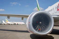 Other Ethiopian Airlines aircraft are seen in the distance behind an Ethiopian Airlines Boeing 737 Max 8 as it sits grounded at Bole International Airport in Addis Ababa, Ethiopia Saturday, March 23, 2019. The chief of Ethiopian Airlines says the warning and training requirements set for the now-grounded 737 Max aircraft may not have been enough following the Ethiopian Airlines plane crash that killed 157 people.