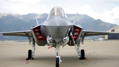 In this Sept. 2, 2015, file photo, an F-35 jet sits on the tarmac at its new operational base at Hill Air Force Base, in northern Utah. Singapore's Defense Minister Ng Eng Hen told Parliament on Friday that the government has decided to purchase four F-35 fighter jets made by Lockheed Martin of the United States, with an option for another eight.