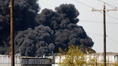 The petrochemical fire at Intercontinental Terminals Company reignited as crews tried to clean out the chemicals that remained in the tanks, Friday, March 22, 2019, in Deer Park, Texas. The efforts to clean up a Texas industrial plant that burned for several days this week were hamstrung Friday by a briefly reignited fire and a breach that led to chemicals spilling into the nearby Houston Ship Channel.