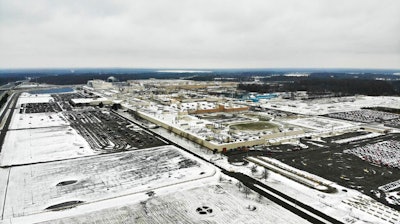 In this Nov. 28, 2018, file photo, snow covers the perimeter of the General Motors' Lordstown plant, in Lordstown, Ohio. GM employees in Lordstown and other factories in Michigan and Maryland that are targeted to close within a year say moving will force them to leave behind relatives, even their children, in some cases.