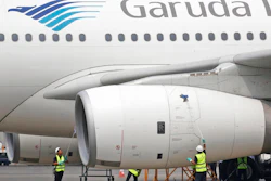In this Sept. 28, 2015, file photo, workers clean a jetliner at GMF AeroAsia facility at Soekarno-Hatta International Airport in Jakarta, Indonesia. Indonesia's flag carrier is seeking the cancellation of a multibillion-dollar order for 49 Boeing 737 Max 8 jets, citing a loss of confidence in the model following two crashes in the space of a few months.