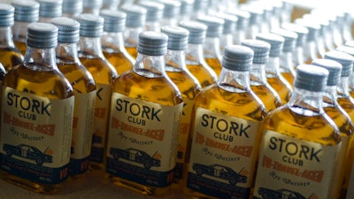 In this Thursday, Feb. 28, 2019 photo, bottles of a special edition of Stork Club rye whiskey stand in a storage room of the German whiskey maker Spreewood Distillerie in Schlepzig, Germany.