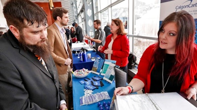 n this Thursday, March 7, 2019, photo visitors to the Pittsburgh veterans job fair meet with recruiters at Heinz Field in Pittsburgh. On Friday, March 8, the U.S. government issues the February jobs report, which will reveal the latest unemployment rate and number of jobs U.S. employers added.