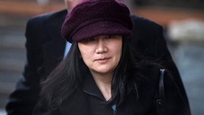 In this Jan. 29, 2019, file photo, Huawei chief financial officer Meng Wanzhou leaves her home to attend a court appearance in Vancouver, British Columbia. Canada said Friday, March 1, 2019, it will allow the U.S. extradition case against Wanzhou to proceed. She is due in court on March 6, at which time a date for her extradition hearing will be set. Meng is wanted in the U.S. on fraud charges that she misled banks about the company's business dealings in Iran.