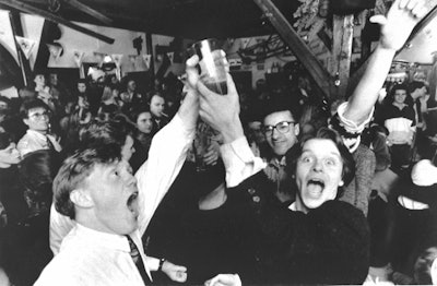 In this Wednesday March 2, 1989 file photo, Icelanders celebrate in a Reykjavik bar, as the first legal beer since 1915 went on sale in the Icelandic capital. On Friday, March 1, 2019 the country toasts the anniversary of the lifting of a decades-long ban on beer with what else? - a nationwide Beer Day.