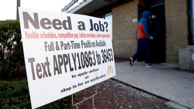 In this Jan. 3, 2019, file photo customers enter a McDonald's restaurant near an employment sign visible in Atlantic Highlands, N.J. On Wednesday, March 6, payroll processor ADP reports how many jobs private employers added in February.