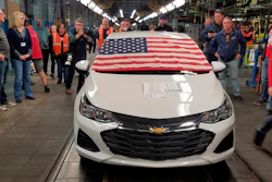 An American flag drapes the hood of the last Chevrolet Cruze as it comes off the assembly line at a General Motors plant where 1,700 hourly positions are being eliminated perhaps for good, on Wednesday, March 6, 2019, in Lordstown, Ohio. The factory near Youngstown is the first of five North American auto plants that GM plans to shut down by next year.
