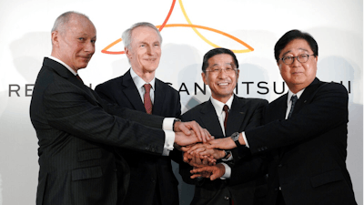 From left, Renault CEO Thierry Bollore, Renault Chairman Jean-Dominique Senard, Nissan CEO Hiroto Saikawa and Mitsubishi Motors Chairman and CEO Osamu Masuko pose for photographers after their joint press conference at the Nissan headquarters in Yokohama, near Tokyo, Tuesday, March 12, 2019. The chief executives of Renault, Nissan and Mitsubishi announced Tuesday a new board to oversee the French-Japanese auto alliance, in an effort to drive home a message about what they called “a new start” for the partnership, despite the recent arrest of former chairman Carlos Ghosn.