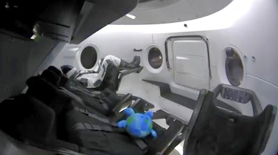 This photo provided by SpaceX shows a life-size test dummy along with a toy that is floating in the Dragon capsule as the capsule made orbit on Saturday, March 2, 2019. America's newest capsule for astronauts rocketed toward the International Space Station on a high-stakes test flight by SpaceX. This latest, flashiest Dragon is on a fast track to reach the space station Sunday morning, just 27 hours after liftoff.