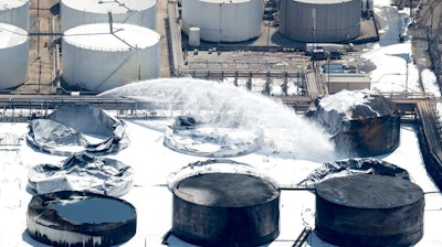 Emergency crews continue to douse what's left of the now-extinguished petrochemical tank fire at Intercontinental Terminals Company on Wednesday, March 20, 2019, in Deer Park. Fire crews extinguished the blaze at ITC about 3 a.m., Wednesday, almost four days after it started, which caused a plume of black smoke to linger over the Houston area. ITC officials said the cause of the fire is still unknown. EPA on-site coordinator Adam Adams said they have been in Deer Park since Sunday, conducting air monitoring at ground level and in the plume. Biggest concerns are 'volatile organic chemicals' and particulates, Adams said. He added that no hazardous levels have been detected.